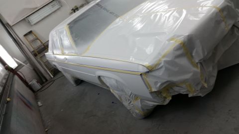 1991 Ford LTD Crown Victoria - Car bodywork covered for painting, showing the rear quarter panel and window area.