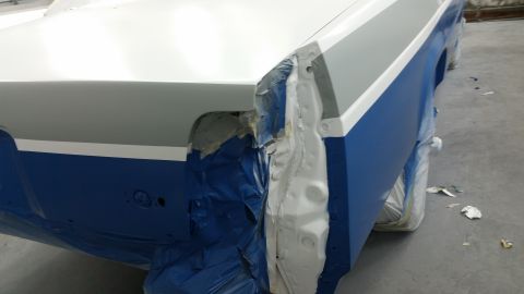 1991 Ford LTD Crown Victoria - Rear quarter panel of a 1991 Ford Crown Victoria LTD undergoing paint preparation.