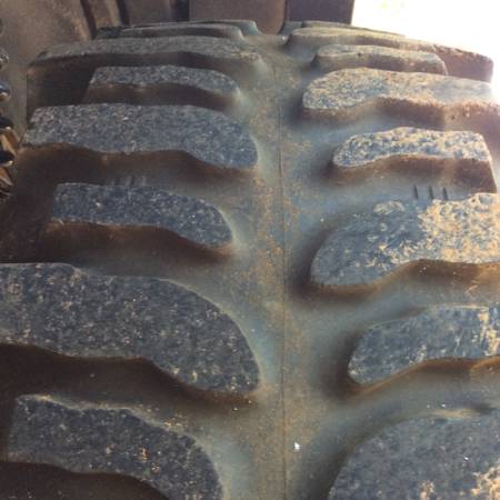 1979 Ford Bronco - A detailed view of a heavy-duty tire tread, likely from an off-road vehicle.