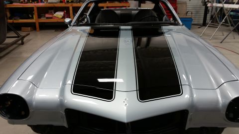 1970 Chevrolet Camaro - Front view of a silver 1970 Chevrolet Camaro, dual black racing stripes.