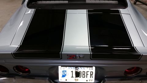 1970 Chevrolet Camaro - Rear view of a silver 1970 Chevrolet Camaro with racing stripes and a Z28 badge.