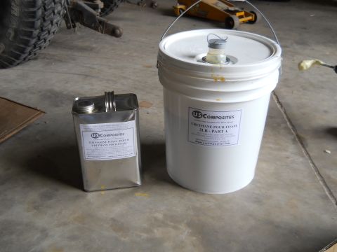 1992 Ford Bronco - Two containers of US Composites urethane pour foam are shown on a concrete floor.