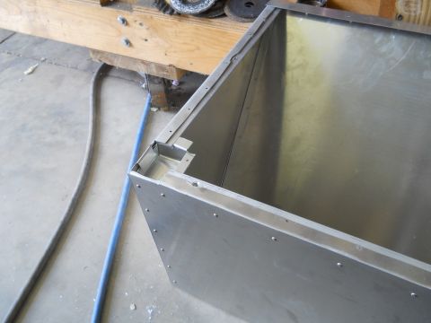 1992 Ford Bronco - A partially constructed metal box is shown from a close-up angle, resting on a workshop floor.