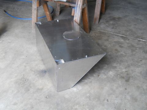 1992 Ford Bronco - A custom-fabricated metal fuel tank sits on a concrete floor, possibly in a workshop.