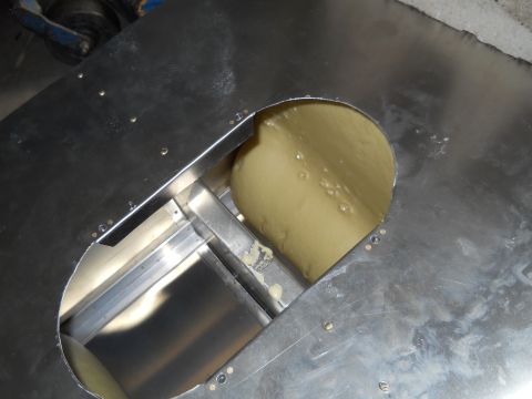 1992 Ford Bronco - Metal casing with a yellow substance visible through an opening.