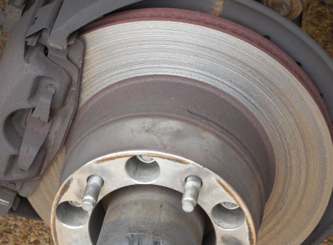 1983 Ford Bronco - These pads are about 11 years old; the rotor was factory; the spacer is so I can run Dodge 16" rims. [url=http://www.supermotors.net/r…