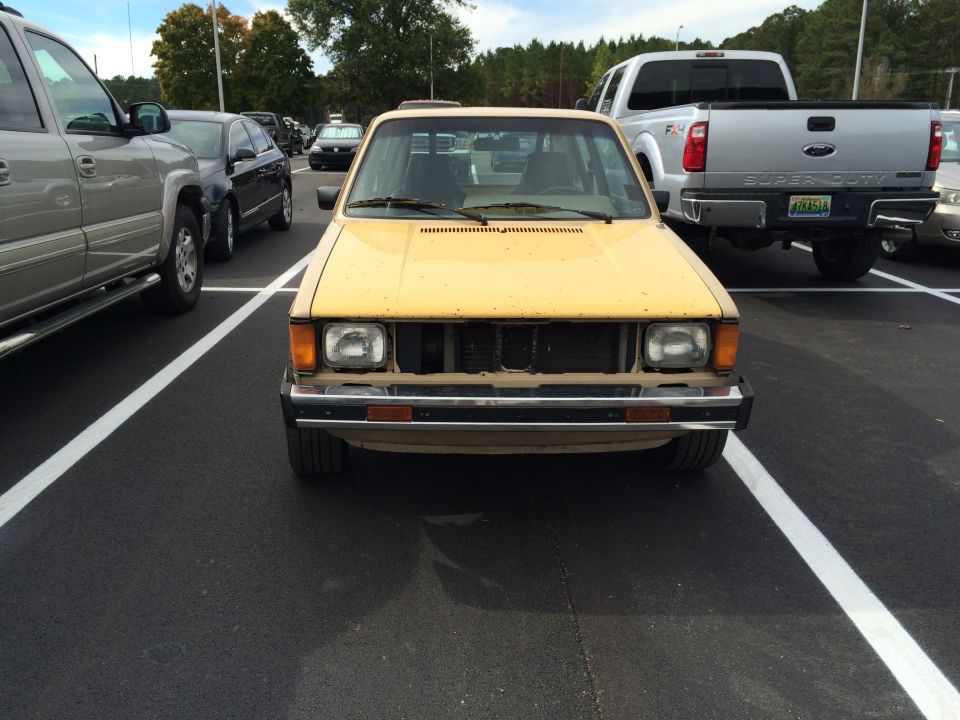 Yellow 1983 Volkswagen Rabbit front view in a parking lot