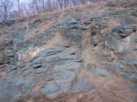 1990 Ford Bronco - Rocky outcrop along a road, likely during late fall or winter.