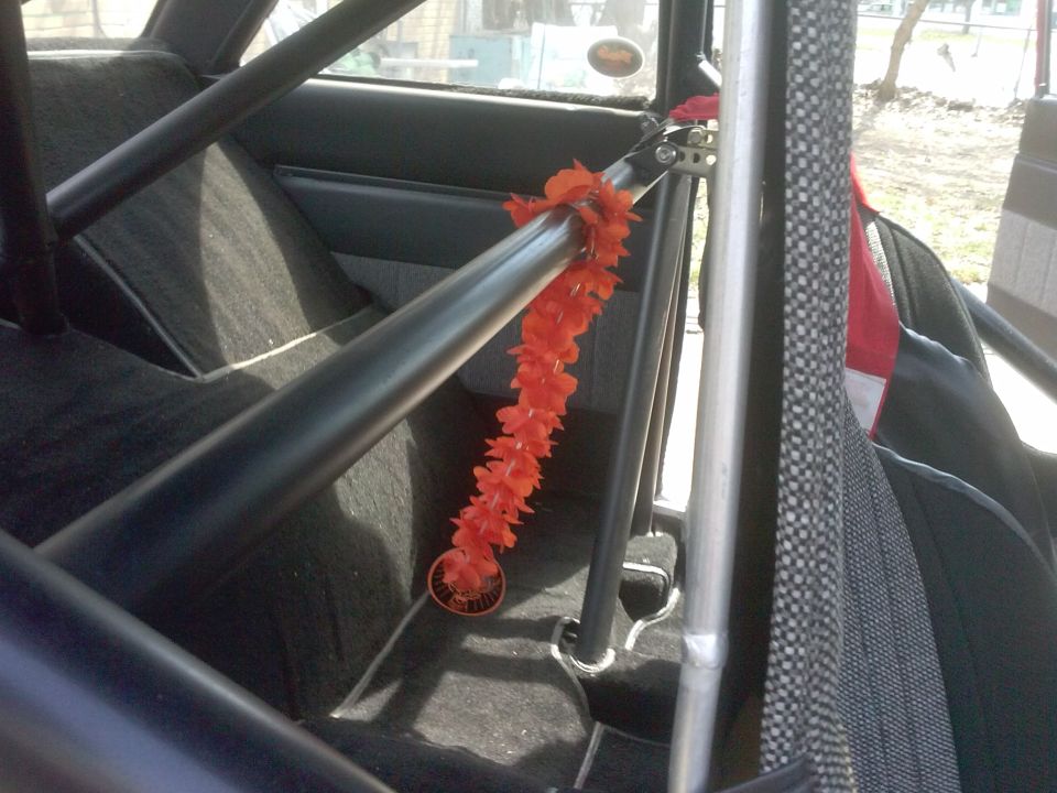 Interior with roll cage and orange lei