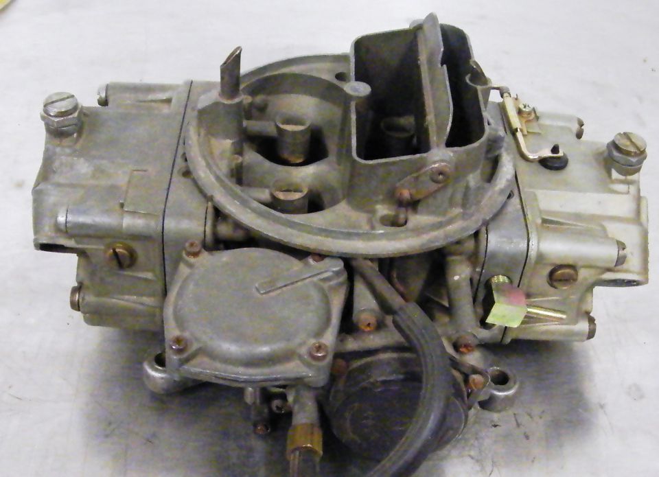 Carburetor with visible text "SUPERMOTORS"
