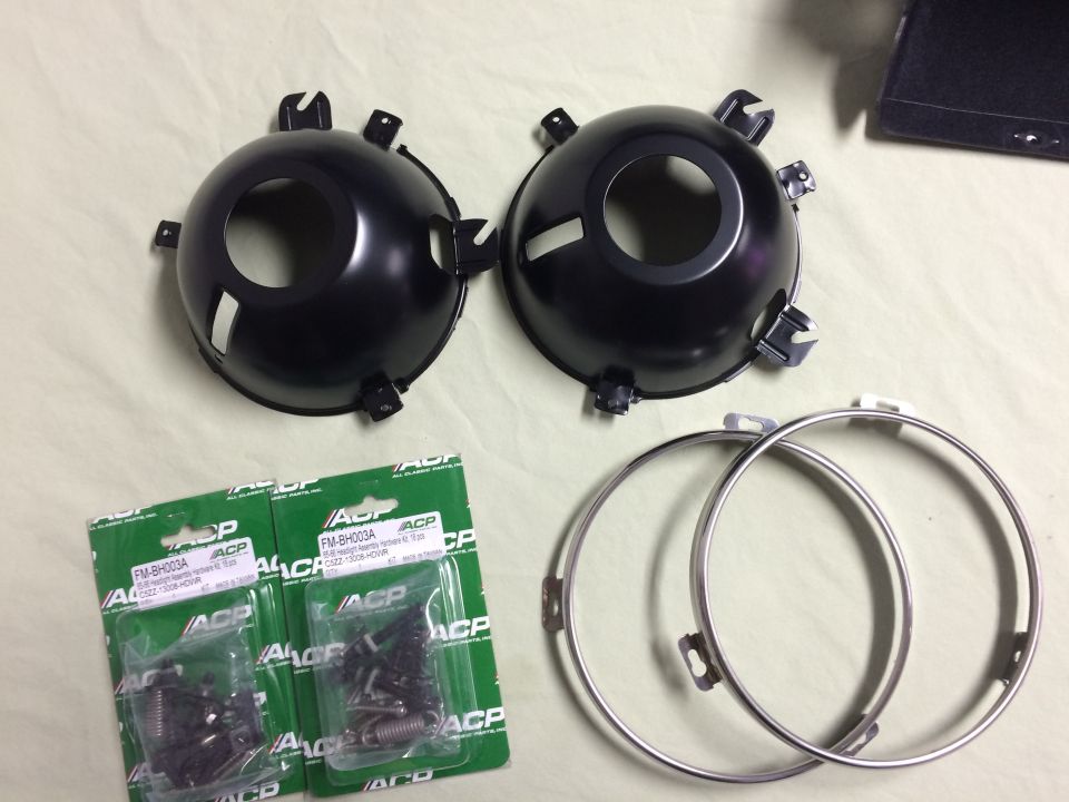 1965 Mustang headlight buckets, stainless rings, and hardware kit