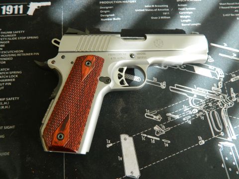 1979 Ford Bronco - A pistol rests on a diagram detailing firearm components and assembly.