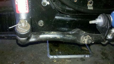 1982 Ford Bronco - Steering linkage part with a ROUGH COUNTRY sticker visible.