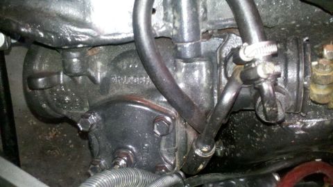 1982 Ford Bronco - This is a close-up view of a vehicle's power steering gearbox, showing hoses and mechanical components.