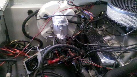 1982 Ford Bronco - Close-up view of a vehicle's engine bay, showing the brake system and electrical wiring.