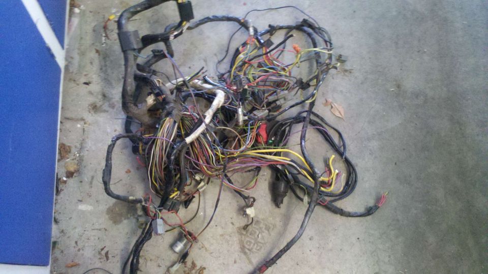 Tangled wiring harness with many colored wires and connectors
