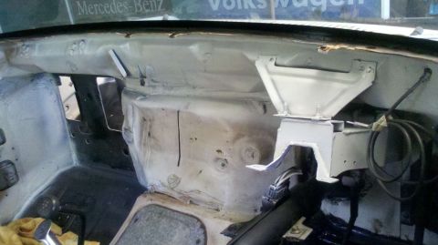 1982 Ford Bronco - Vehicle interior firewall area during a rebuild project, with exposed metal and wiring visible.