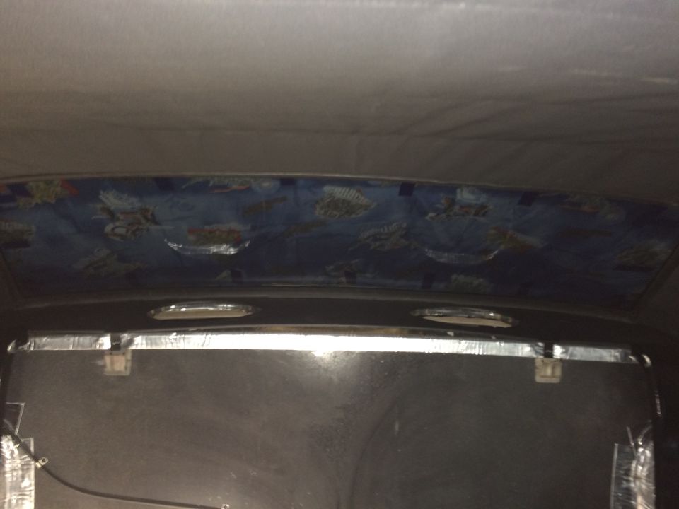 1965 Mustang package tray liner installed with hold down brackets