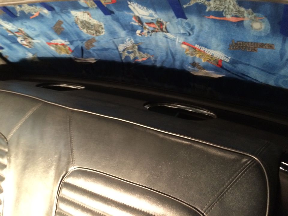 1965 Mustang package tray liner installed with hold down brackets