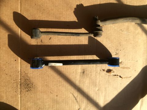 1997 Dodge 3500 - Comparison of a used sway bar link with a new one blue polyurethane bushings.