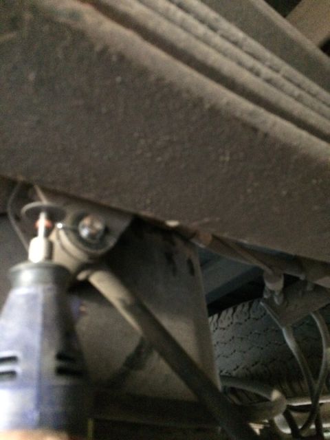 1997 Dodge 3500 - Underside view of a truck's rear suspension system, focusing on the leaf springs and mounting hardware.