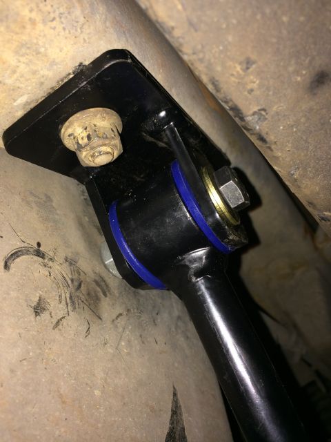 1997 Dodge 3500 - Underside view of a vehicle's sway bar mounting bracket with blue polyurethane bushings.