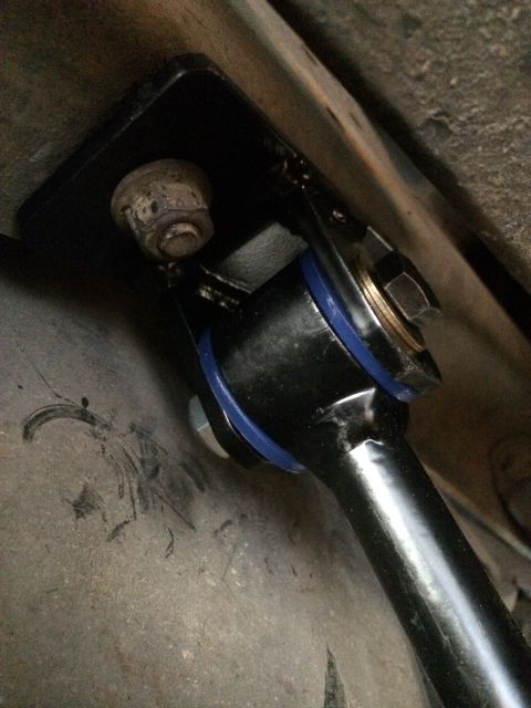 1997 Dodge 3500 - Close-up view of a vehicle's sway bar end link, showing its connection point and bushings.