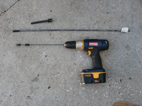 1994 Ford Bronco - Ryobi drill and automotive cables laid out on a concrete surface.