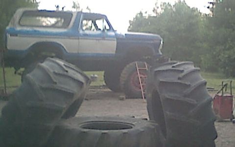 1978 Ford Bronco - I just got the axles rolled under it , they were not even bolted in yet. those are my bigger tires in the foreground (55" tall x24" wide )