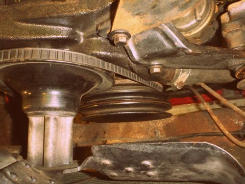 1964 Mercury Monterey - Close-up of an engine's V-belt and pulley system.