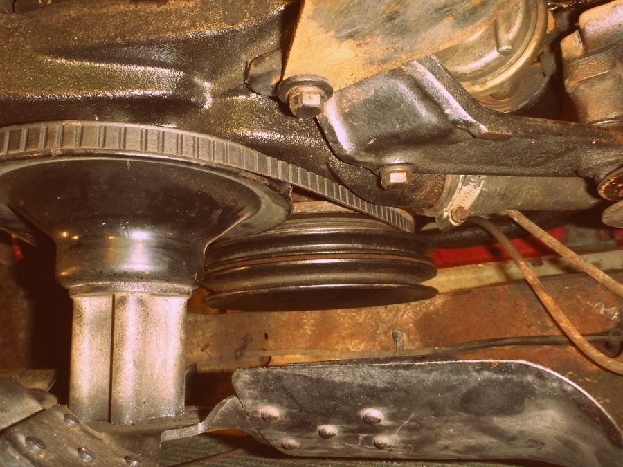 Engine crankshaft pulley with a V-belt routed around it