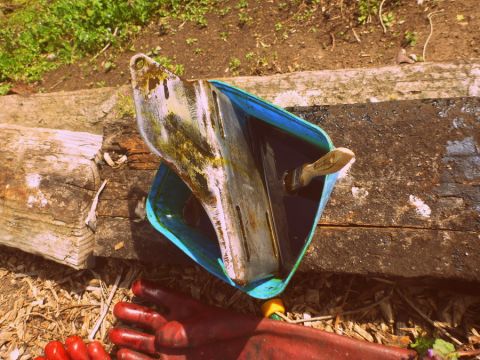 1964 Mercury Monterey - A metal part is soaking in a blue container with a brush. Red gloves are visible in the foreground.