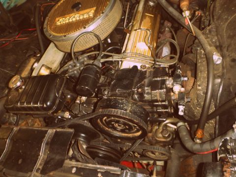 1964 Mercury Monterey - Close-up view of an engine bay, focusing on the air cleaner and drive belts.