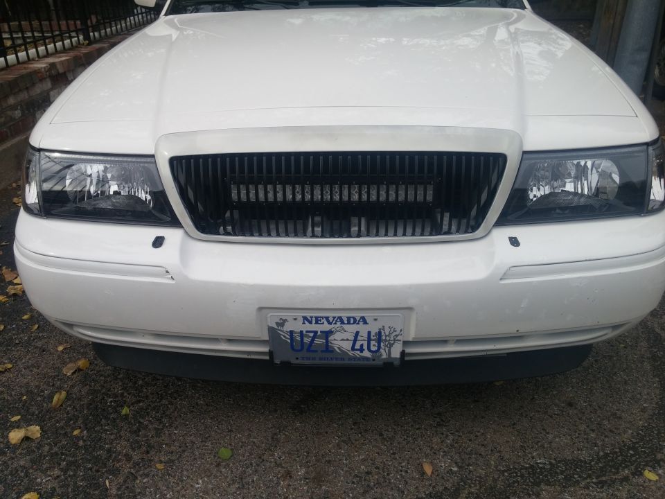 White 2000 Mercury Grand Marquis front view, showing grille and Nevada license plate UZT 4U