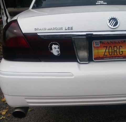 2000 Mercury Grand Marquis - The rear of a white 2000 Mercury Grand Marquis LSE shows its LSE badging and a custom license plate.