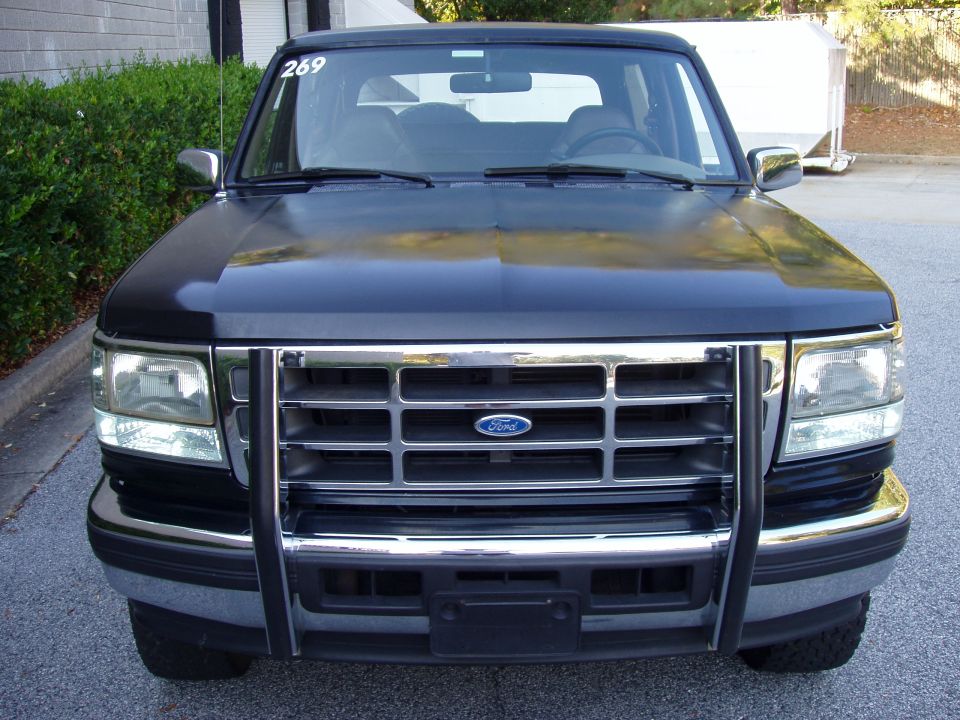 Black 1996 Ford Bronco front view with chrome grille and bull bar