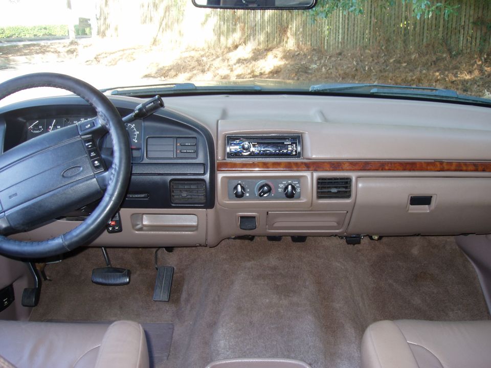 1996 Ford Bronco interior showing dashboard, steering wheel, and center console
