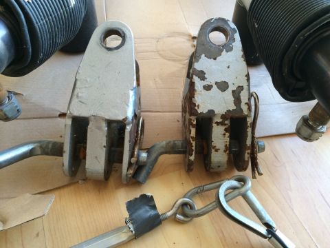 2003 Honda CR-V - Close-up of two tow bar components, showing wear and rust on one piece.