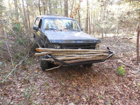 1983 Ford Bronco - This was a light load. The grille guard will carry MUCH more weight. (It also makes a reasonably-comfortable toilet seat.)