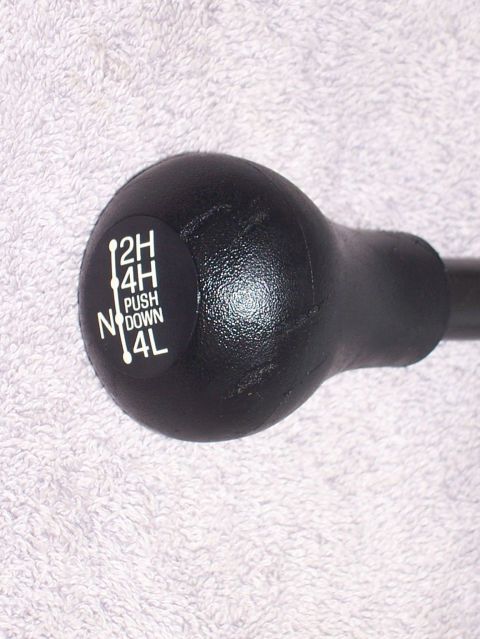 1990 Ford Bronco - Transfer case shifter knob with drive mode indicators.