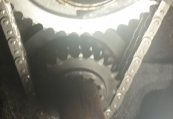 Close-up of engine timing chain and sprockets