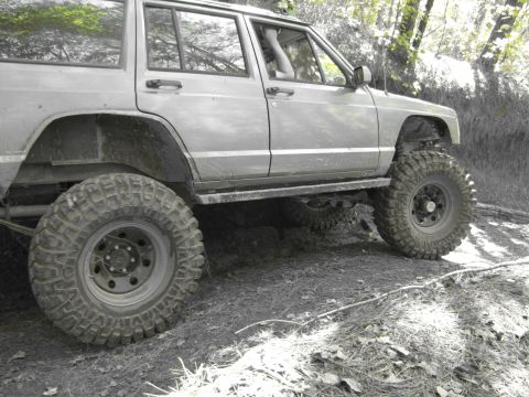 1995 Ford Bronco - This modified SUV is equipped for off-road terrain, with its large tires and lifted suspension.