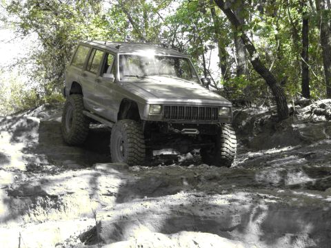 1995 Ford Bronco - This modified Jeep Cherokee XJ navigates a challenging off-road course.