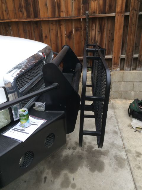 1997 Dodge 3500 - A truck's front bumper is fitted with a custom rack, with a can of drink resting on the bumper.