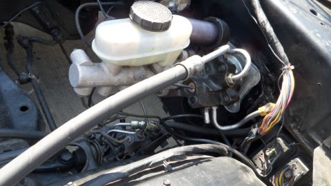 1972 Ford Ranchero - Close-up of a vehicle's brake master cylinder and associated plumbing.