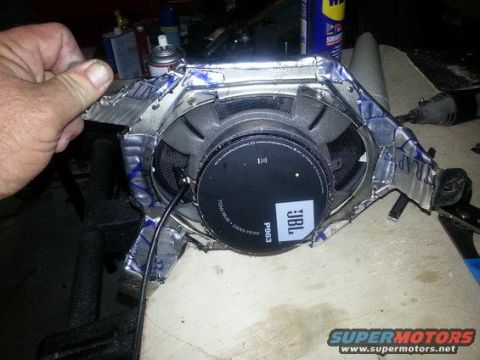 1994 Ford Bronco - A JBL speaker is shown with a makeshift mounting bracket, likely for installation in a vehicle.