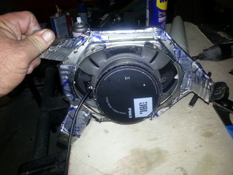 1994 Ford Bronco - Photograph of a JBL P963 car speaker mounted in a taped baffle, not a technical document.