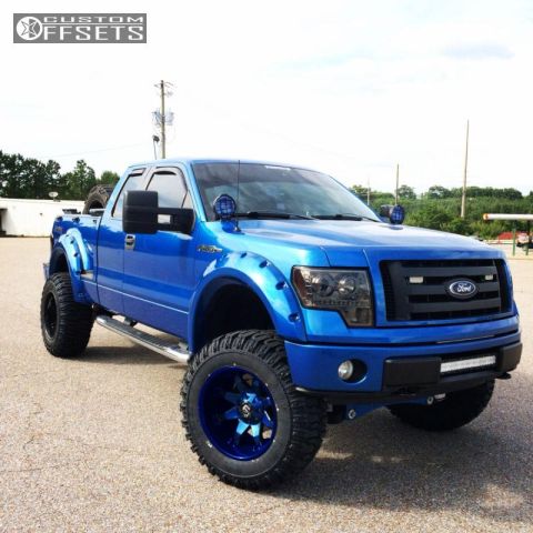 1994 Ford Bronco - A lifted, bright blue Ford F-150 pickup truck is shown from a 3/4 front angle, featuring custom wide fender flares, large off-road tires, a…