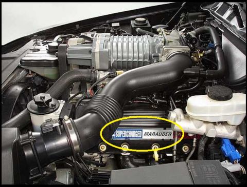2000 Mercury Grand Marquis - The engine compartment of a vehicle is shown in this photograph.