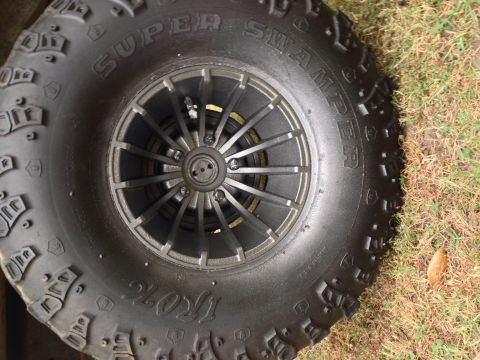 1979 Ford Bronco - Close-up of a large off-road tire and wheel assembly.